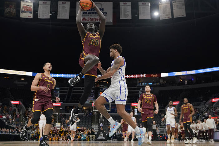 Loyola of Chicago's Aher Uguak (30) heads to the basket during the first half of an NCAA college basketball game against Drake in the championship of the Missouri Valley Conference tournament on March 6.