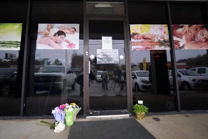 A makeshift memorial is seen outside one of the spas targeted in the shooting that occurred on March 16, 2021, in Acworth, Ga.