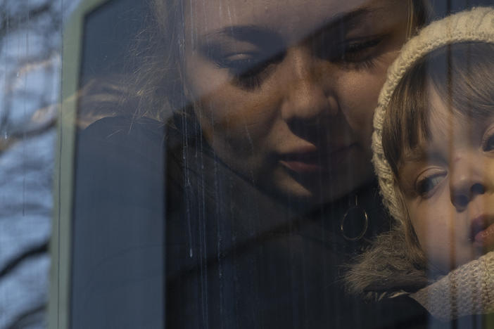 <strong>March 12:</strong> Families board buses to the border of Poland in Lviv, Ukraine.