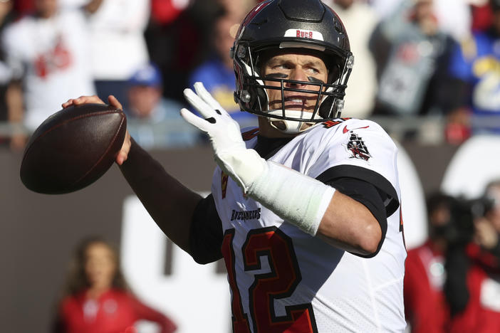 Tampa Bay Buccaneers quarterback Tom Brady throws a pass against the Los Angeles Rams during the first half of an NFL divisional round playoff football game in January in Tampa, Fla. Brady's retirement lasted 40 days. He said Sunday, March 13, he is returning to the Buccaneers for his 23rd season in the NFL.