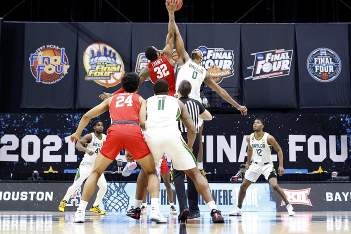 For the first time in the history of the March Madness tournament, NCAA athletes will be able to profit off their names, images and likenesses. Above, Reggie Chaney of the Houston Cougars and Flo Thamba of the Baylor Bears compete for the opening tipoff during the 2021 tournament.