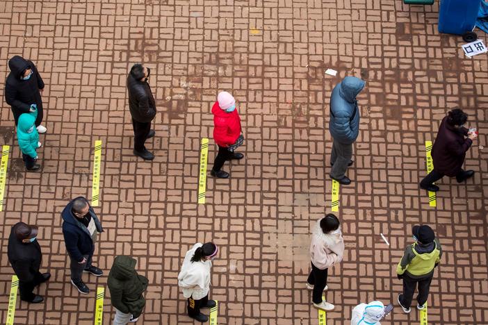 Residents queue to undergo tests for the coronavirus in China's northeastern Jilin province on Saturday.