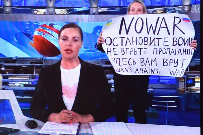 Russian Channel One employee Marina Ovsyannikova interrupted a live broadcast in Moscow on Monday, holding up a poster reading "No War" and condemning Moscow's military action in Ukraine.