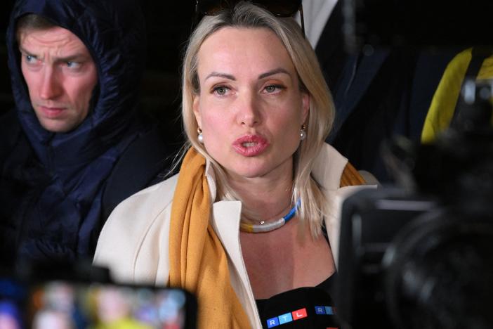 Marina Ovsyannikova, an editor at the state broadcaster Channel One who protested against Russian military action in Ukraine during the evening news show at the station late Monday, speaks to the media Tuesday as she leaves the Ostankinsky District Court after being fined 30,000 rubles ($280) for breaching protest laws in Moscow.