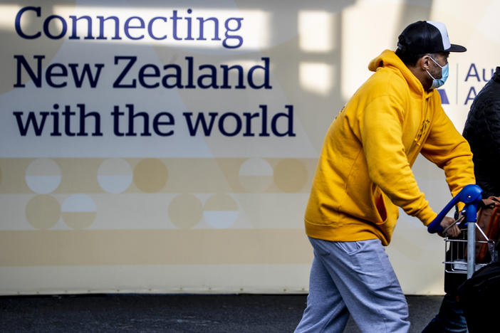 Passengers arrive at Auckland's International Airport, in Auckland, New Zealand, on Wednesday.