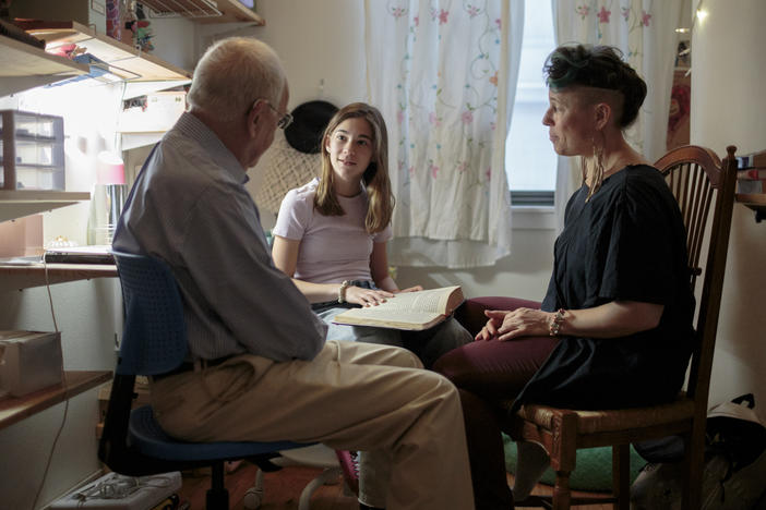Nomi Kline Solmsen prepares for her bat mitzvah, reading the Torah in her bedroom with her grandfather, Rabbi David Kline, and her aunt Shira Kline.