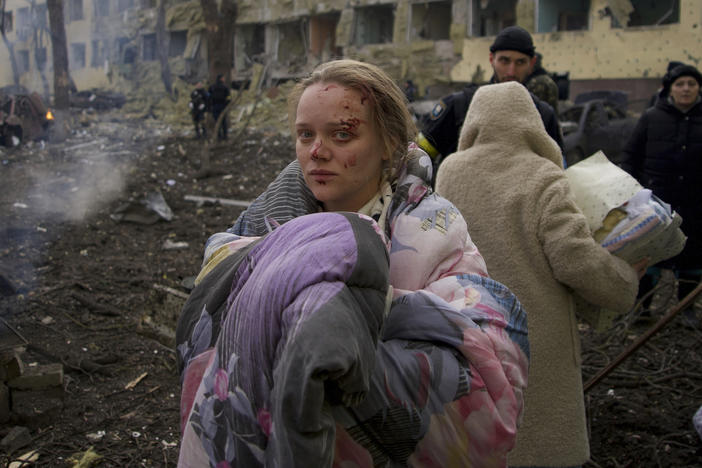 Mariana Vishegirskaya stands outside a maternity hospital that was damaged by shelling in Mariupol, Ukraine, on March 9. Vishegirskaya later gave birth to a girl in another hospital in Mariupol.