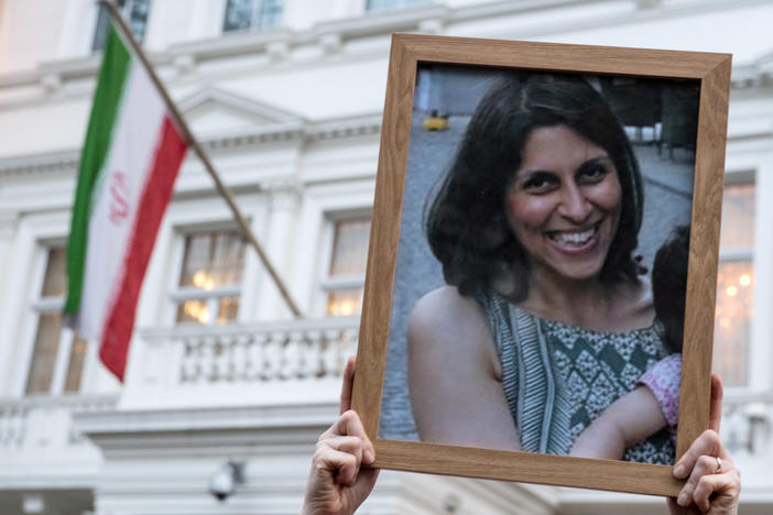 Supporters hold a photo of Nazanin Zaghari-Ratcliffe during a vigil in London in 2017. Iran released Zaghari-Ratcliffe, who was imprisoned in 2016, and Anousheh Ashouri, a businessman, on Wednesday.