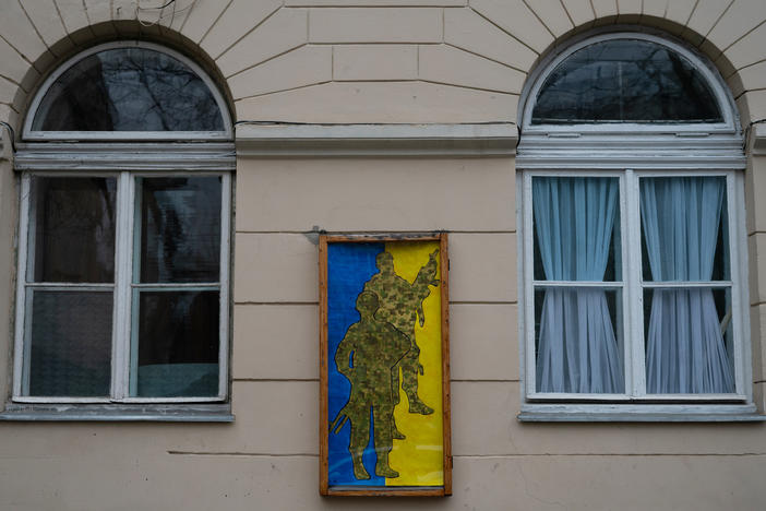 A pro-Ukrainian military poster hangs on a building in downtown Lviv, Ukraine.