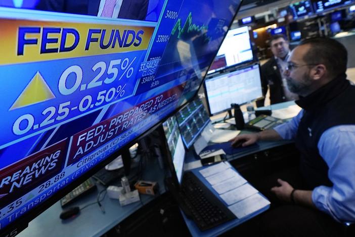The floor of the New York Stock Exchange this week, after the Federal Reserve announced a quarter-point hike in its key interest rate. The Fed is raising rates to curb inflation, but that will hit some Americans in their wallets.