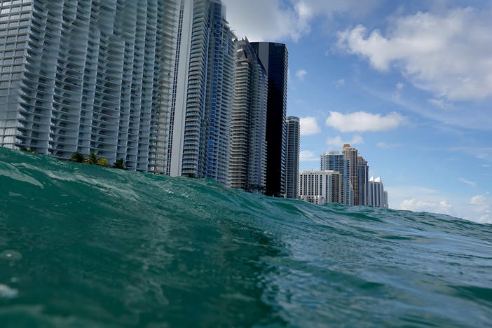 Waves lap ashore near condo buildings in Sunny Isles, Fl., on Aug. 9, 2021. Rising sea levels are seen as one of the potential consequences of climate change and could impact areas such as Florida's Miami-Dade County.