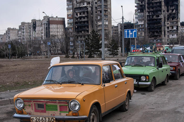 Cars wait in a long line to leave Mariupol, on March 17. The city, on Ukraine's southeastern coast, has been heavily damaged by Russian bombardment.