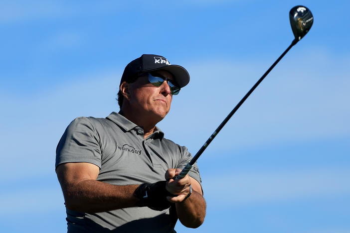 Phil Mickelson plays a shot on the fifth hole during the first round of The Farmers Insurance Open at Torrey Pines Golf Course on January 26, 2022 in La Jolla, California.