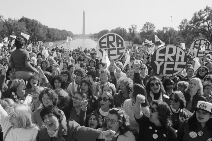 A large crowd of women cheers a speaker at the Lincoln Memorial, during a rally for passage of the Equal Rights Amendment.