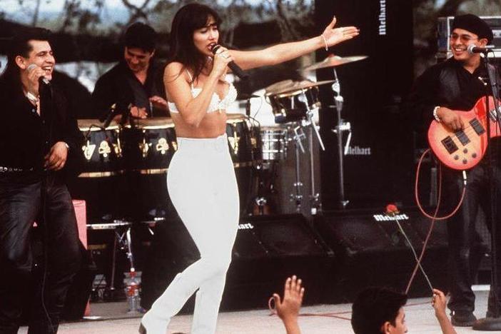 Actress Jennifer Lopez, who plays Selena Quintanilla-Perez in the movie <em>Selena</em> performs with her band in one of the scenes from the movie. The biopic will premiere in theaters next month in honors of the film's 25th anniversary.