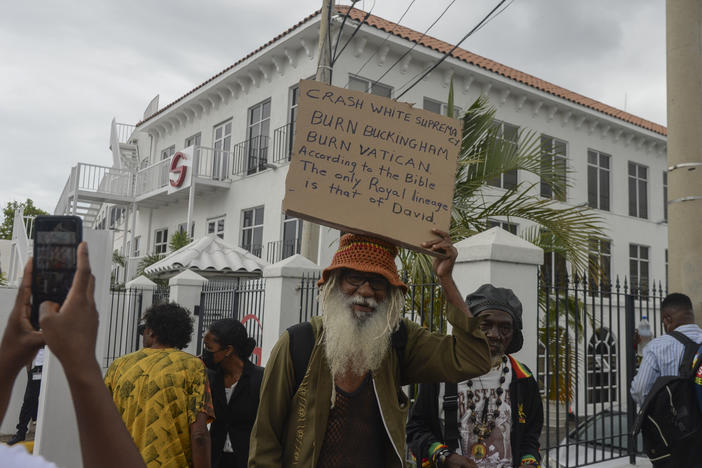 People protest to demand an apology and slavery reparations during a visit to the former British colony by the Duke and Duchess of Cambridge, Prince William and Kate, in Kingston, Jamaica, on Tuesday.