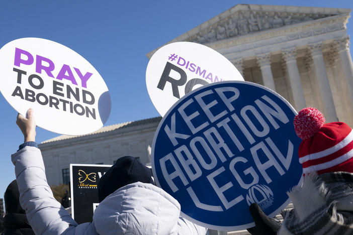 Activists from both sides of the abortion debate participate in a demonstration outside of the U.S. Supreme Court in January.