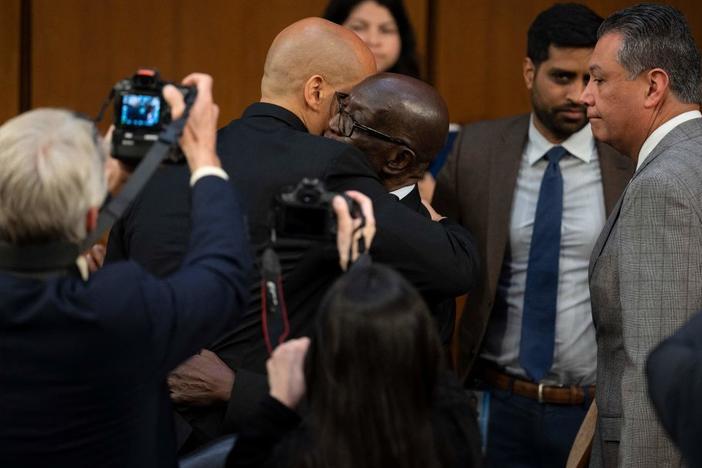 U.S. Sen. Cory Booker, D-N.J., hugs Johnny Brown, the father of Judge Ketanji Brown Jackson, after Booker spoke Wednesday during the Senate Judiciary Committee confirmation hearing on her nomination to become a justice on the U.S. Supreme Court.