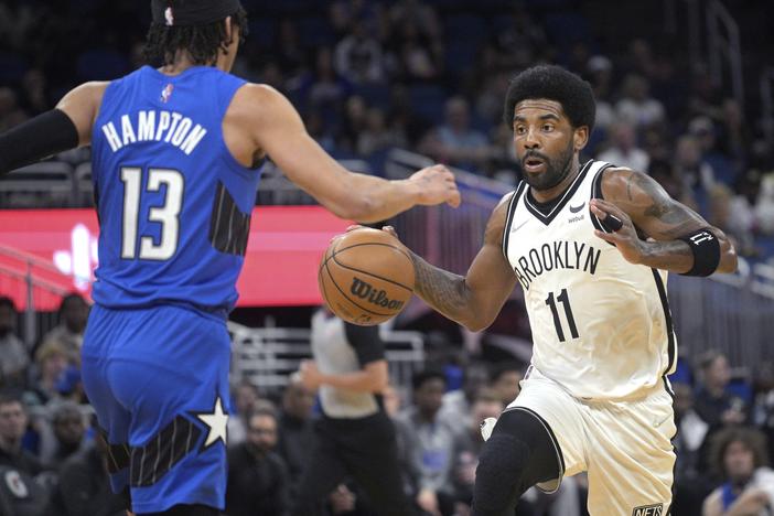 Brooklyn Nets guard Kyrie Irving, number 11, is shown playing March 15, 2022, in Orlando, Fla.