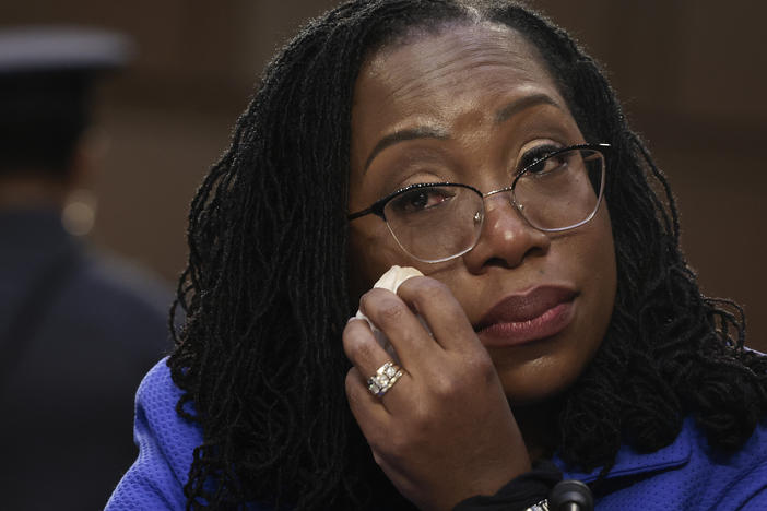 Supreme Court nominee Judge Ketanji Brown Jackson wipes away tears during her confirmation as Sen. Cory Booker quotes Langston Hughes in support of her.