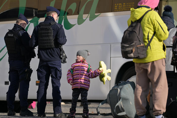 People pass through Przemysl station in Poland on their journey out of war-torn Ukraine on Thursday. One in four Ukrainians have been displaced from their homes in the past month.