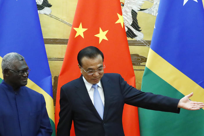 Solomon Islands Prime Minister Manasseh Sogavare, left, and Chinese Premier Li Keqiang attend a signing ceremony at the Great Hall of the People in Beijing, on Oct. 9, 2019.