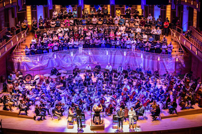 A March 24 dress rehearsal for "A Knee on the Neck." Front, from left: Mezzo-soprano J'Nai Bridges, National Philharmonic Orchestra and Chorale Music Director Piotr Gajewski, tenor Norman Shankle and baritone Kenneth Overton. Behind: The National Philharmonic Orchestra and Chorale, joined by members of The Washington Chorus and The Howard University Chorale.