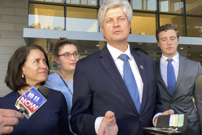 U.S. Rep. Jeff Fortenberry, R-Nebraska, center, speaks with the media outside the federal courthouse in Los Angeles, on Thursday.