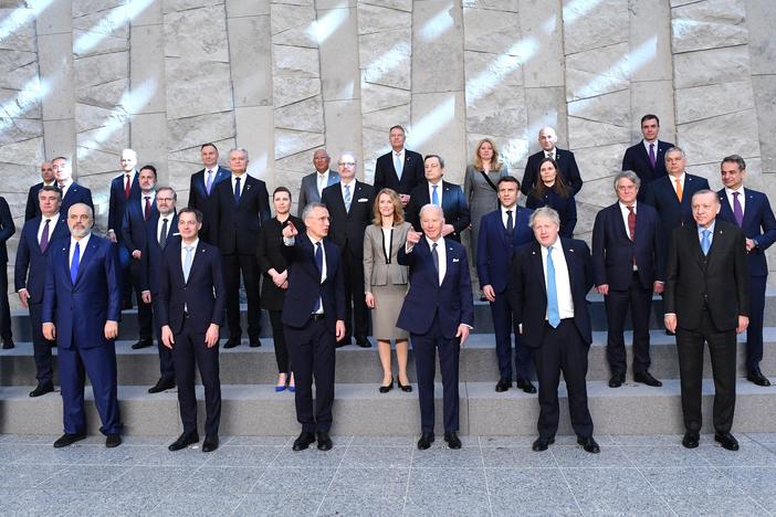 Leaders of NATO member nations pose for a photo at NATO headquarters in Brussels on March 24.