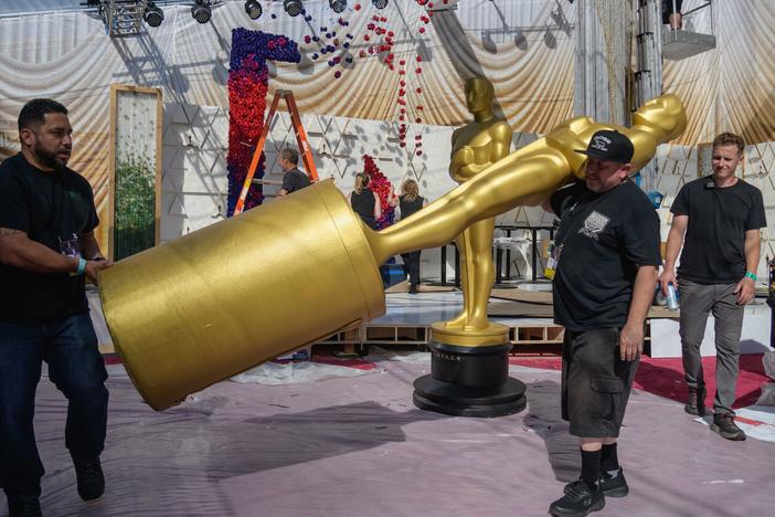 Workers prepare the red carpet area on Friday ahead of the Oscars at the Dolby Theatre.