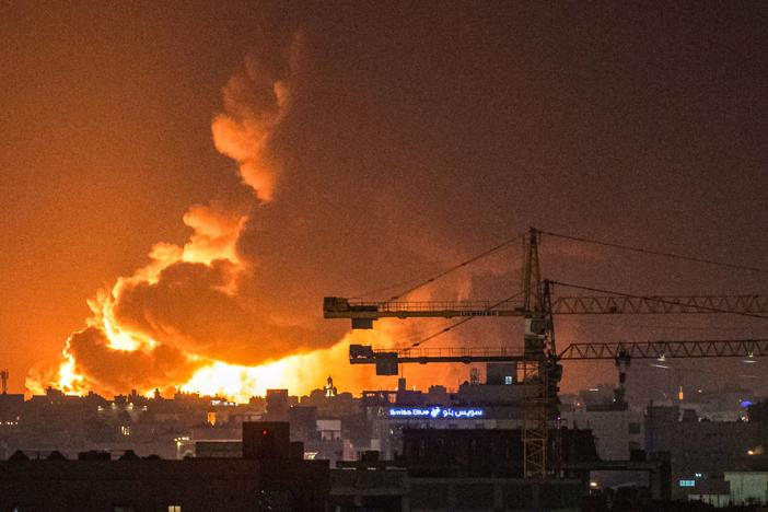 Smoke and flames rise from a Saudi Aramco oil facility in Jeddah following a reported attack by Yemeni rebels. A huge cloud of smoke was seen near the Formula One venue in the city following the attack.