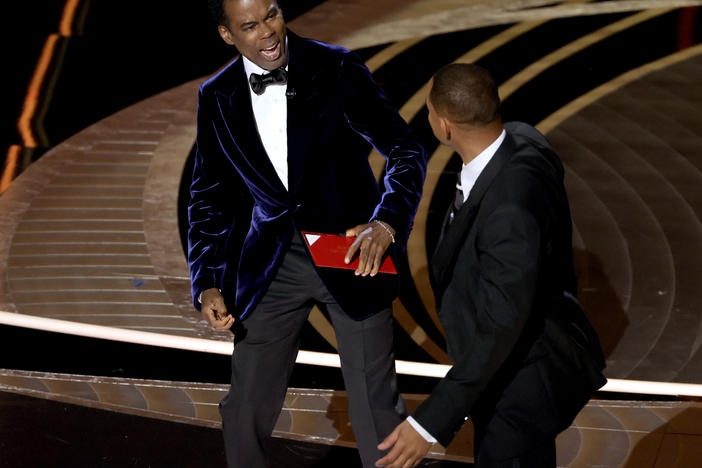 Chris Rock and Will Smith are seen onstage during the 94th Annual Academy Awards at Dolby Theatre following what appeared to be an altercation.