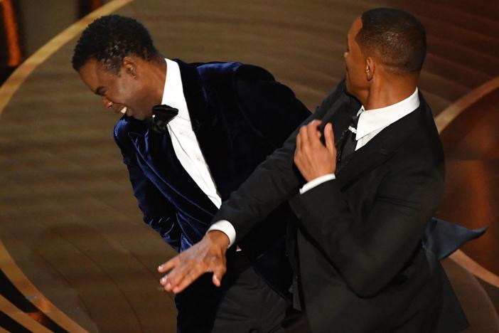 Will Smith slaps actor and comedian Chris Rock onstage during the Oscars.