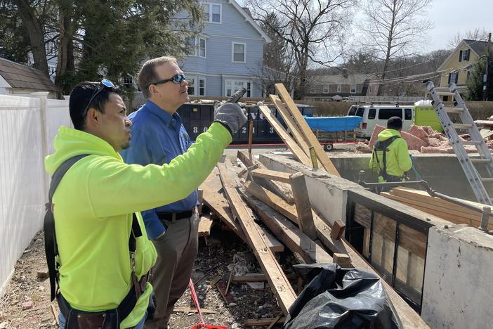 Builder Emerson Claus and his foreman Rene Landeverde at the site of an apartment they are building in a suburb of Boston.