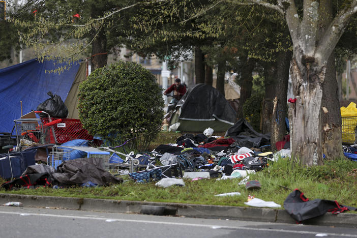 A homeless camp is seen after a vehicle crashed into the camp, killing several people, on Sunday, in Salem, Ore.