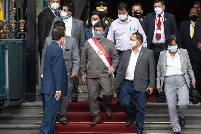Pedro Castillo, Peru's president, center, leaves for an impeachment hearing at the Congress of the Republic in Lima, Peru, on Monday.