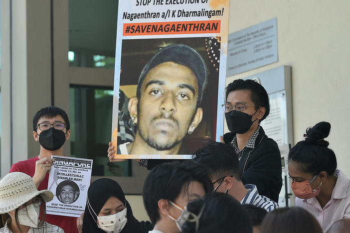 Activists hold posters against the execution of Nagaenthran K. Dharmalingam, sentenced to death for trafficking heroin into Singapore, outside the Singapore High Commision in Kuala Lumpur on March 9, 2022.