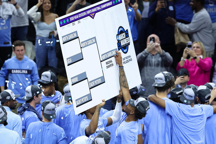 Leaky Black #1 of the North Carolina Tar Heels places the team name on the East Regional Champion bracket slot after the Elite Eight round of the 2022 NCAA Men's Basketball Tournament game against the Saint Peter's Peacocks on March 27 in Philadelphia.