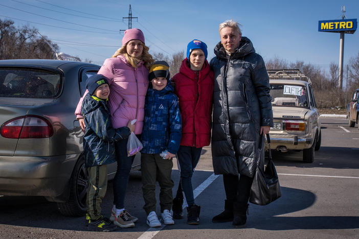 Angelina Voychenko (left) and her children and Yuliya Bortnik (right) and her son fled Mariupol after hiding for weeks in the basement of Voychenko's parents' home, with no electricity, phone service or heat, as the building shook from fighter jets and explosions. When they emerged to buy food, what they saw made them decide to leave: destroyed buildings, looted stores, no food in sight.