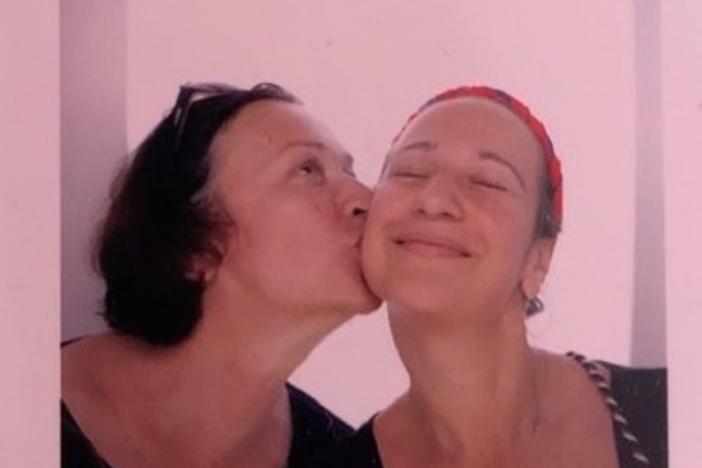 Vita Linnik (left) and Sofia Bretl smile and pose in a photo booth during happier times.