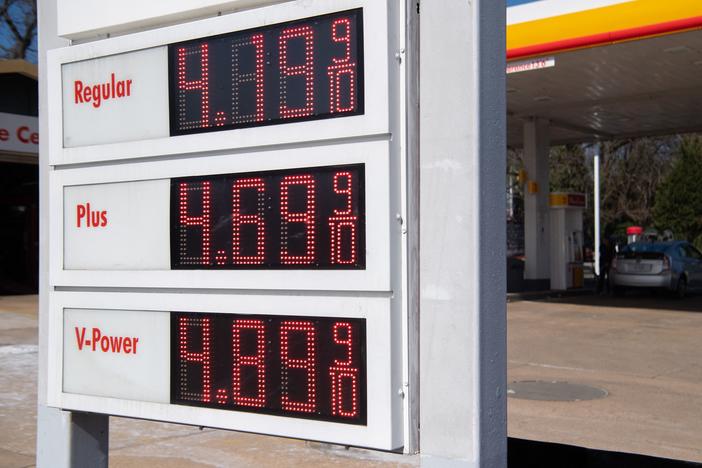 A sign displays fuel prices at a gas station in Arlington, Va., on March 16. President Biden announced on Thursday the country's largest-ever release from its Strategic Petroleum Reserve.