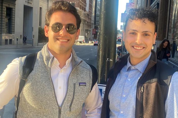 Faris Ajluni (right) land Jose Nazario pose in their vests in downtown San Francisco.