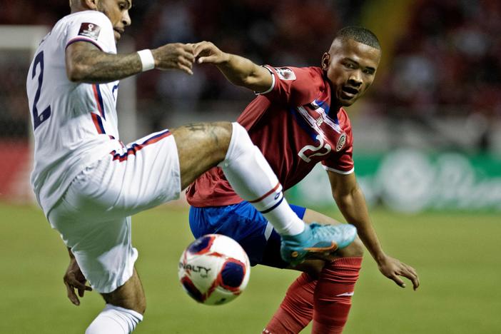 Costa Rica's Ian Lawrence (right) vies for the ball with U.S. player DeAndre Yedlin during their FIFA World Cup Qatar 2022 CONCACAF qualifier match in San Jose, Costa Rica, on Wednesday.