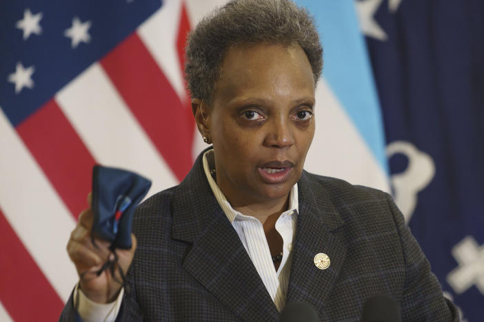 Mayor Lori Lightfoot emphasizes the importance of wearing a mask as she provides an update about the COVID-19 vaccinations at Norwegian American Hospital in Chicago on Tuesday, Jan. 5, 2021.