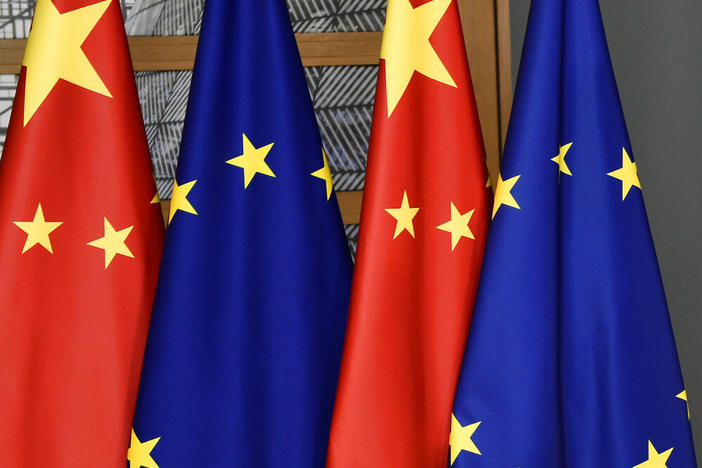 FILE - EU and Chinese flags are seen at the Europa building in Brussels, Tuesday, Dec. 17, 2019 (John Thys/Pool Photo via AP, File)