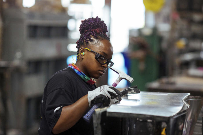 Sheet metal worker Carey Mercer assembles ductwork at Contractors Sheet Metal on Aug. 3, 2021, in New York. New York City and Washington, D.C., are among the cities in which young women earn more than young men, a Pew Research Center study found.