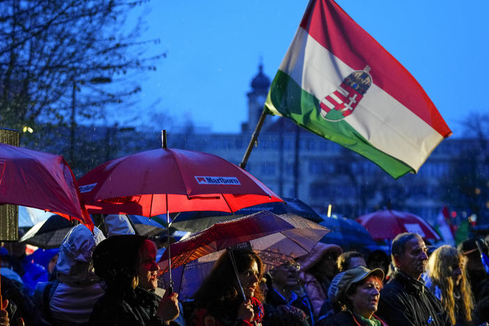 Supporters of United For Hungary, the six-party opposition coalition, chant the national anthem during the final electoral rally in Budapest, Hungary, Saturday, April 2, 2022.
