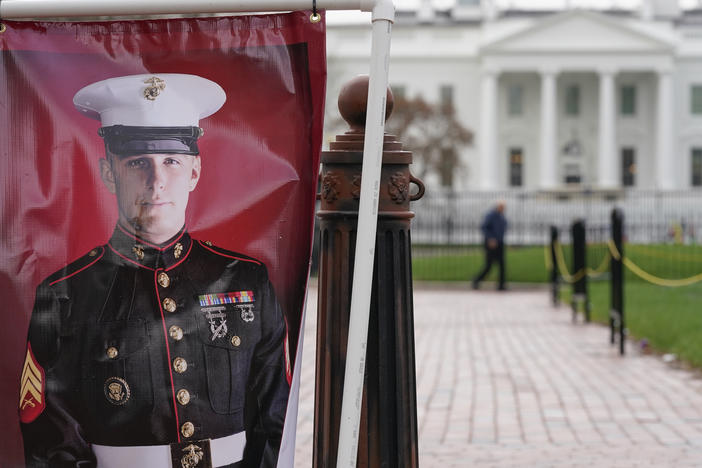 A poster photo of U.S. Marine Corps veteran and Russian prisoner Trevor Reed is hung in Lafayette Park near the White House on Wednesday.