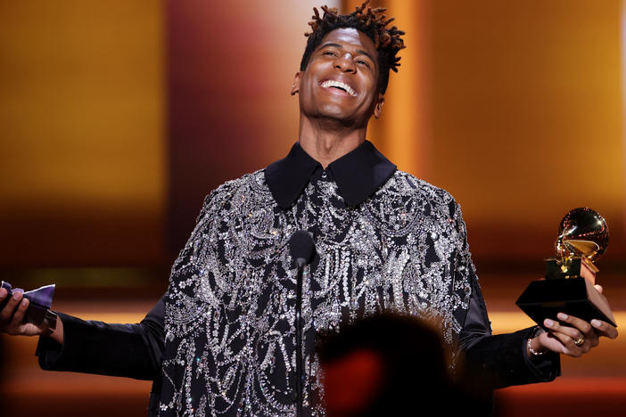 Jon Batiste accepts the Grammy for album of the year at the 64th annual Grammy Awards, presented Sunday, April 3 in Las Vegas. Batiste was the night's biggest winner by the numbers, with five awards including the night's final honor.