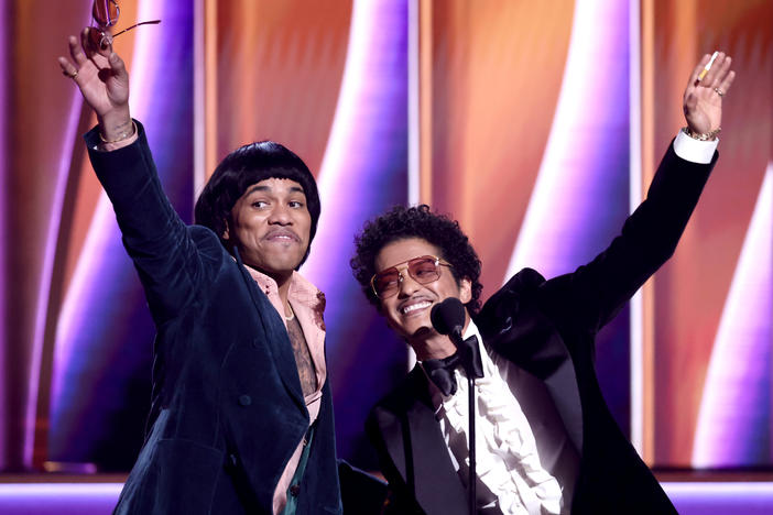 Anderson .Paak and Bruno Mars of Silk Sonic accept the record of the year award for "Leave the Door Open."